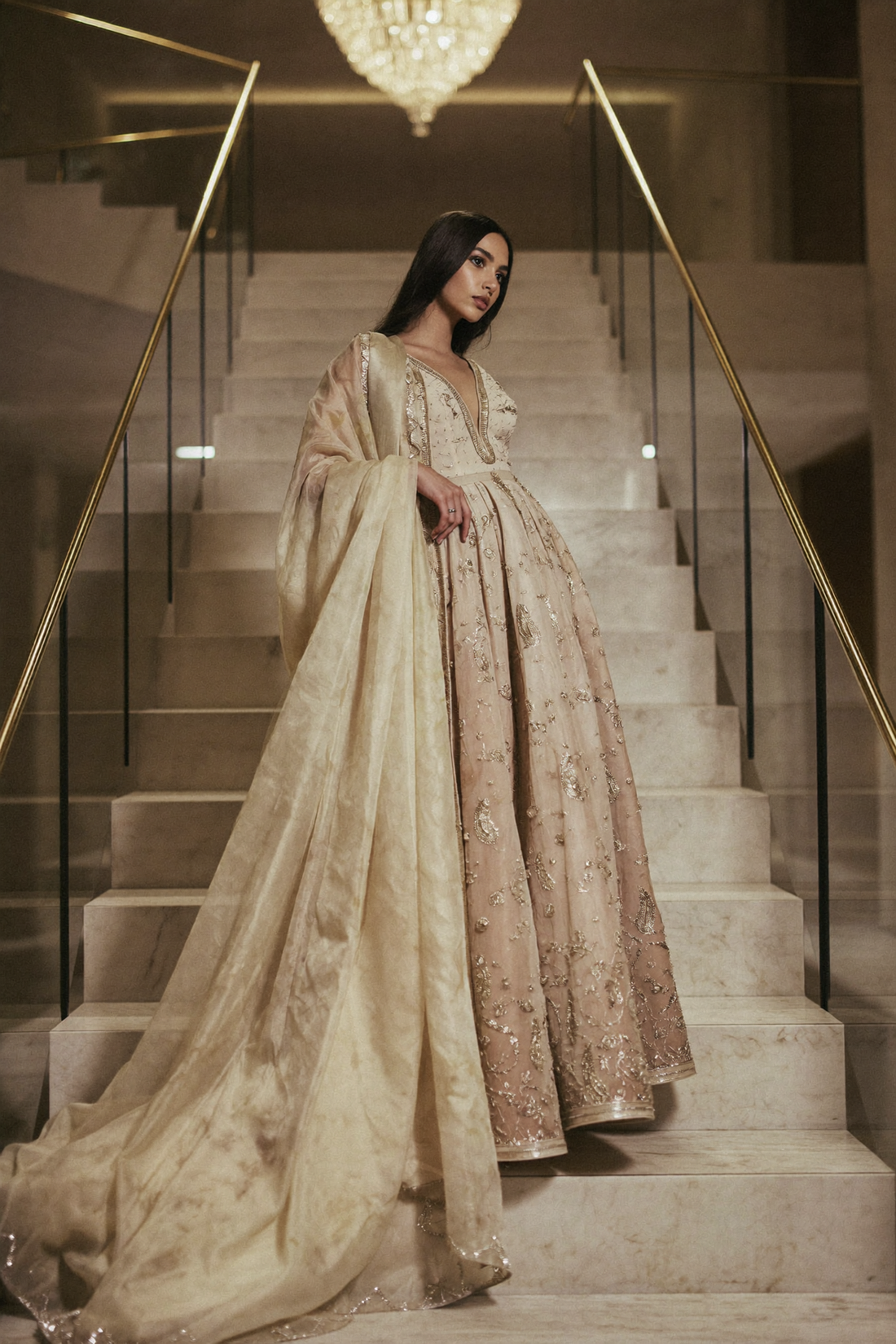 Modern maharani lehenga on a marble palace staircase