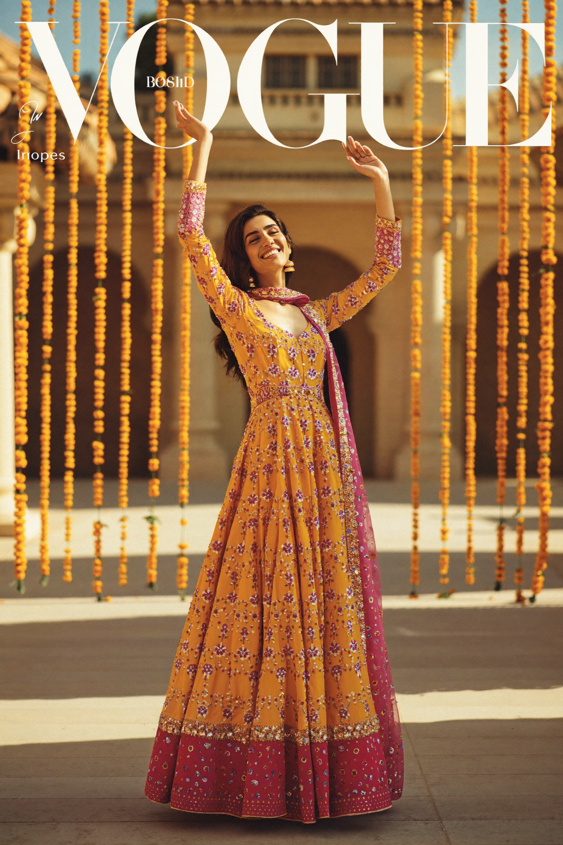 Marigold festive lehenga in a garland-strung courtyard
