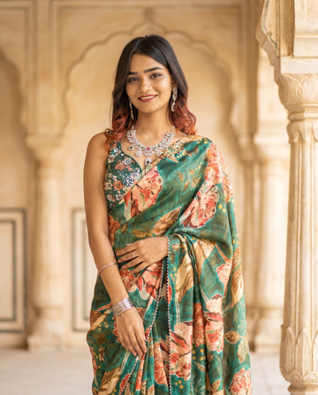 Elegant Indian model in a green floral printed saree